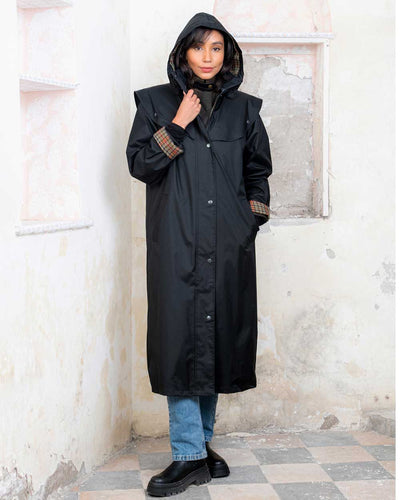 Black coloured Jack Murphy Malvern Ladies Waterproof Bush Coat on wall background #colour_black