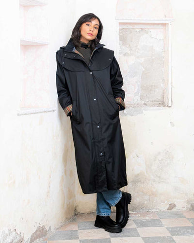 Black coloured Jack Murphy Malvern Ladies Waterproof Bush Coat on wall background #colour_black