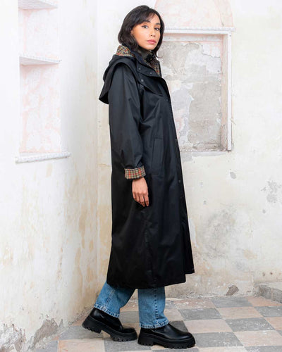 Black coloured Jack Murphy Malvern Ladies Waterproof Bush Coat on wall background #colour_black