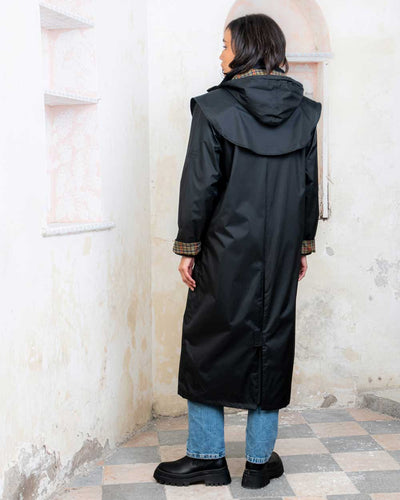 Black coloured Jack Murphy Malvern Ladies Waterproof Bush Coat on wall background #colour_black