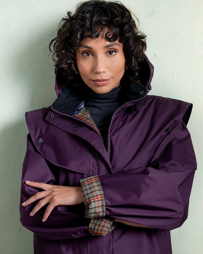 Black Berry coloured Jack Murphy Malvern Ladies Waterproof Bush Coat on wall background #colour_black-berry