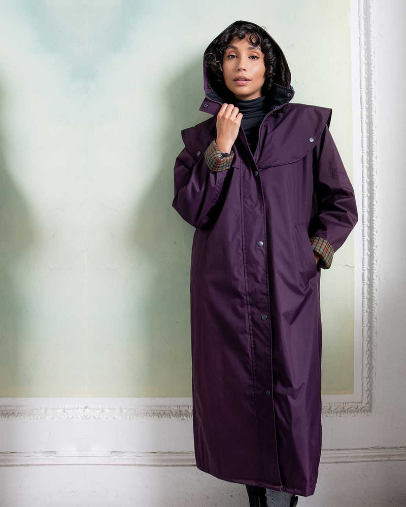 Black Berry coloured Jack Murphy Malvern Ladies Waterproof Bush Coat on wall background 