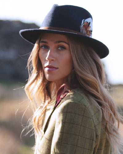 Navy coloured Alan Paine Ladies Richmond Felt Hat on blurry background #colour_navy