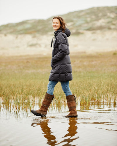 Java coloured Ariat Langdale Waterproof Boots on field background #colour_java