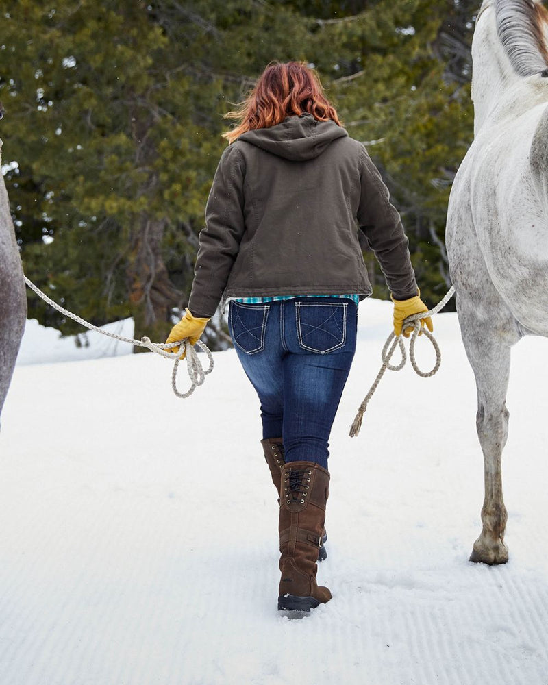 Java coloured Ariat Langdale Waterproof Boots on snow background 