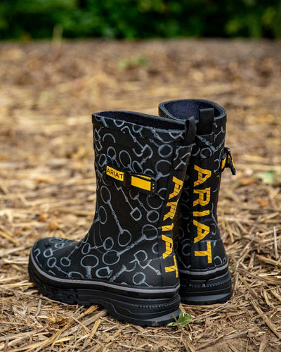 Black Bit Print coloured Ariat Womens Burford Wellington Boots on grassy background #colour_black_bit_print