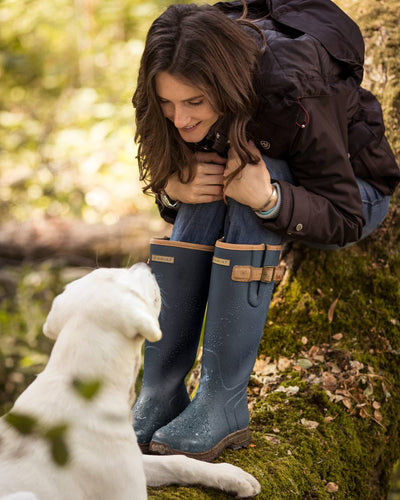 Navy coloured Ariat Womens Burford Wellington Boots on forest background #colour_navy