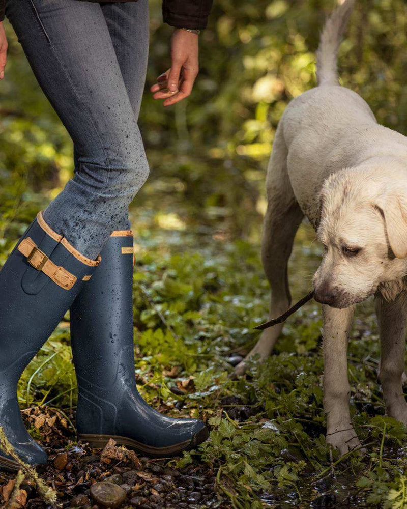 Navy coloured Ariat Womens Burford Wellington Boots on forest background 