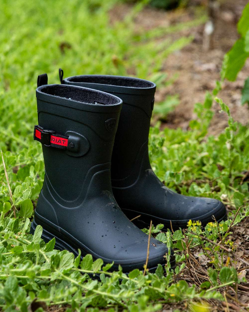 Navy coloured Ariat Womens Burford Wellington Boots on leafy background 