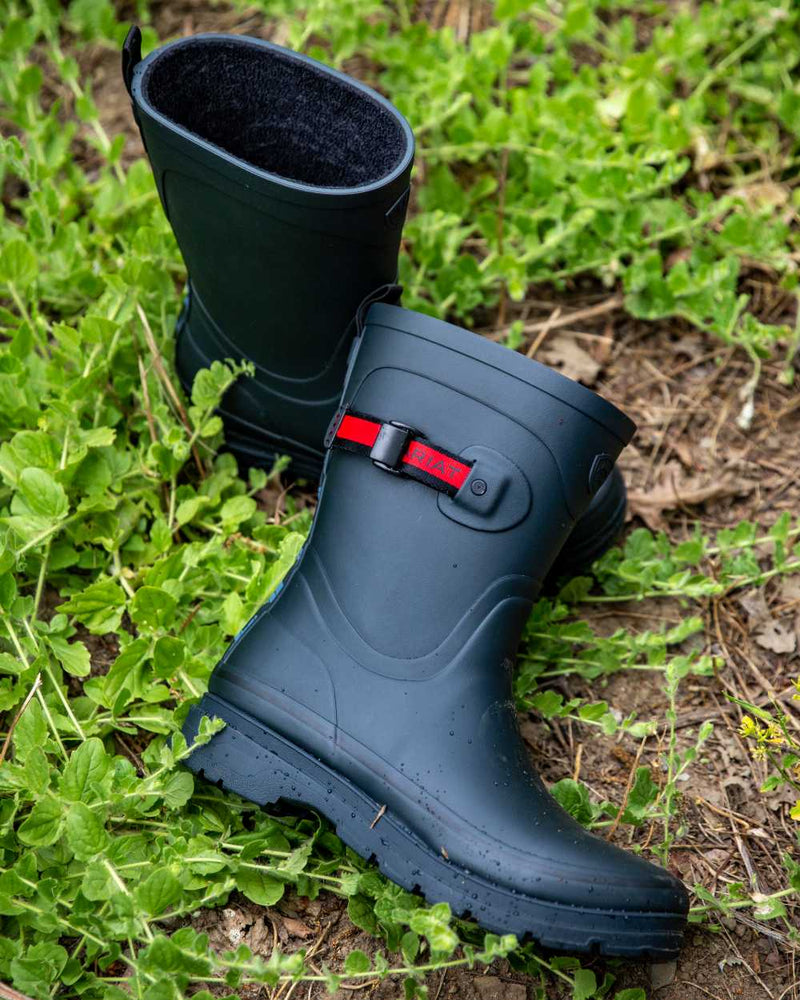 Navy coloured Ariat Womens Kelmarsh Mid Rubber Wellington Boots on leafy background 