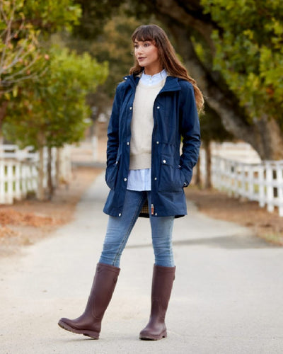 Maroon coloured Ariat Womens Kelmarsh Wellington Boots on Country walkway background #colour_maroon