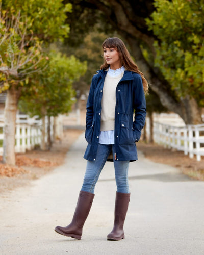 Maroon coloured Ariat Womens Kelmarsh Wellington Boots on Country walkway background #colour_maroon