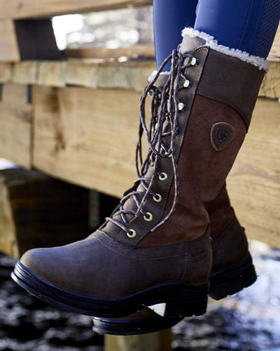 Java coloured Ariat Wythburn Insulated Waterproof Boots on lake background #colour_java