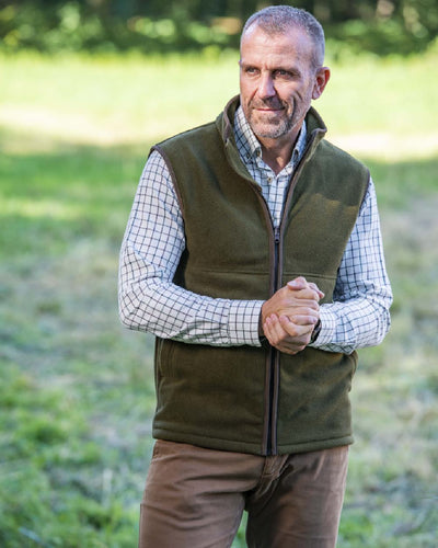 Khaki Coloured Baleno Harvey Fleece Gilet on blurry background #colour_khaki