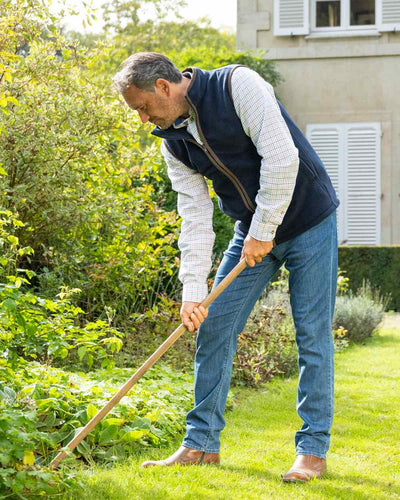 Navy Blue Coloured Baleno Harvey Fleece Gilet on garden background #colour_navy-blue