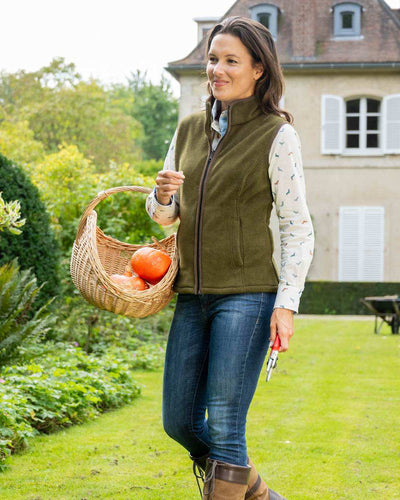 Olive coloured Baleno Sally Ladies Fleece Gilet on garden background #colour_olive