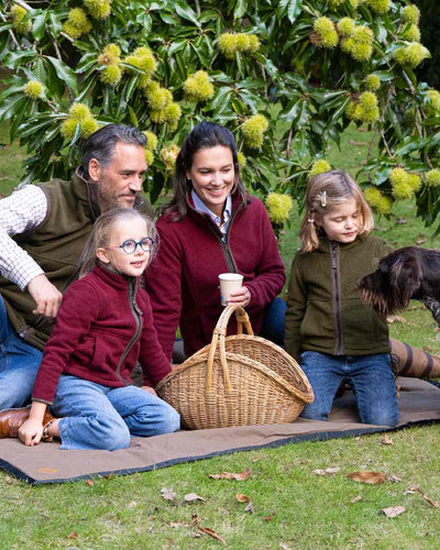 Burgundy Coloured Baleno Sarah Fleece Jacket on garden background #colour_burgundy