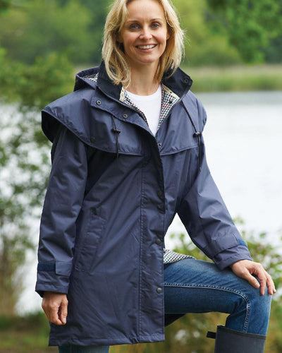 Navy coloured Champion Windsor Ladies' Three-Quarter Length Waterproof Coat on lake background #colour_navy