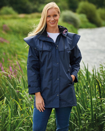 Navy coloured Champion Windsor Ladies' Three-Quarter Length Waterproof Coat on lake background #colour_navy