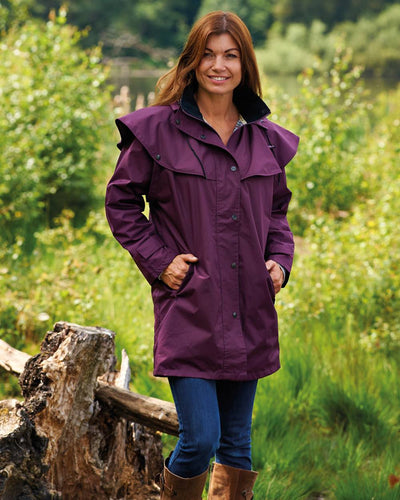 Plum coloured Champion Windsor Ladies' Three-Quarter Length Waterproof Coat on la background #colour_plum