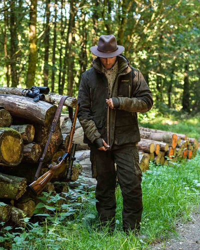 Green Coloured Deerhunter Adventurer Felt Hat on forest background #colour_green