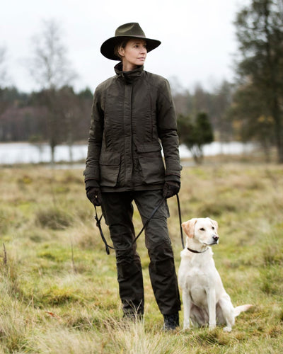 Green Coloured Deerhunter Adventurer Felt Hat on grassy background #colour_green