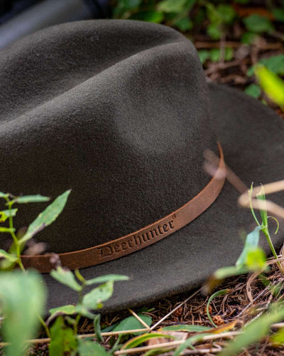 Green Coloured Deerhunter Adventurer Felt Hat on land background #colour_green