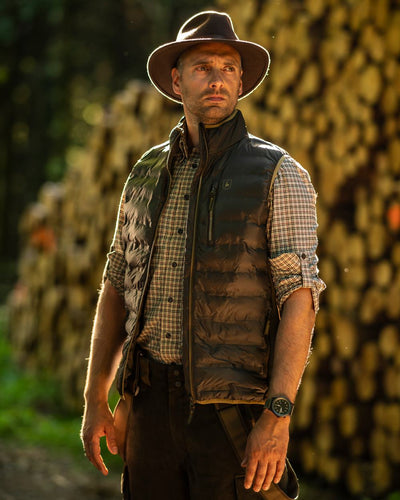 Green Coloured Deerhunter Adventurer Felt Hat on blurry background #colour_green