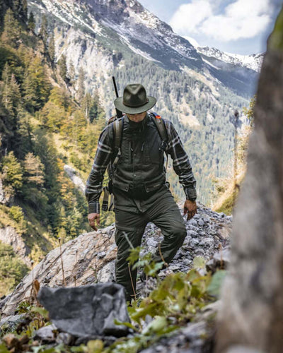 Green Coloured Deerhunter Adventurer Felt Hat on mountain background #colour_green