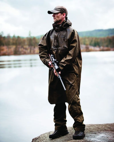 Canteen Coloured Deerhunter Track Rain Long Anorak on blurry background #colour_canteen