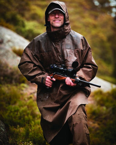 Canteen Coloured Deerhunter Track Rain Long Anorak on blurry background #colour_canteen