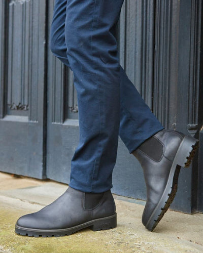 Black coloured Dubarry Antrim Country Boots on wall background #colour_black