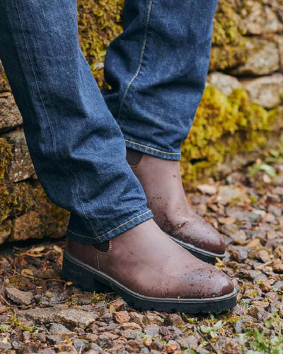 Old Rum coloured Dubarry Antrim Country Boots on stone background #colour_old-rum