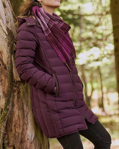 Currant coloured Dubarry Ballybrophy Quilted Jacket on tree background #colour_currant