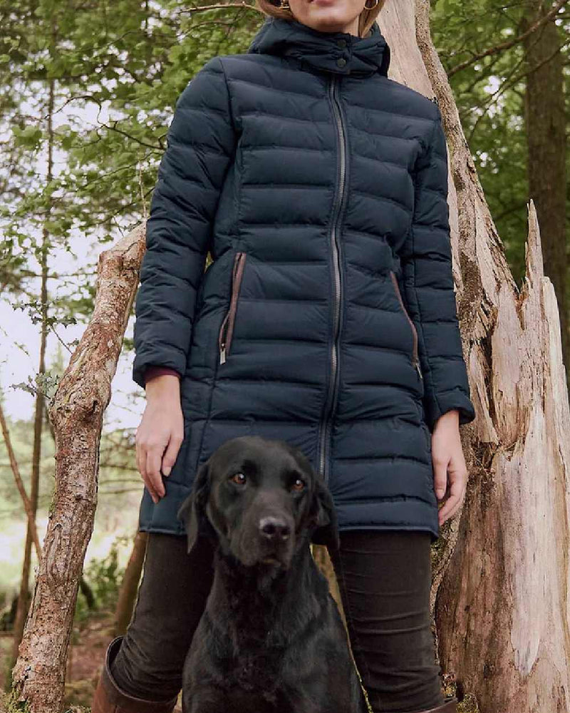 Navy coloured Dubarry Ballybrophy Quilted Jacket on tree background 