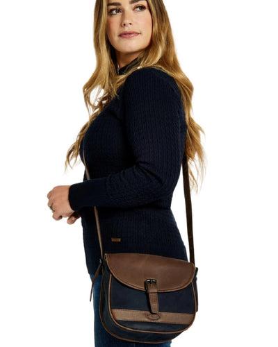 Navy Brown coloured Dubarry Clara Leather Saddle Bag on white background #colour_navy-brown