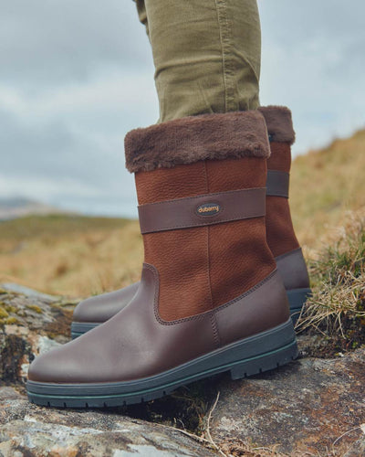 Walnut coloured Dubarry Foxrock Country Boot on rock background #colour_walnut