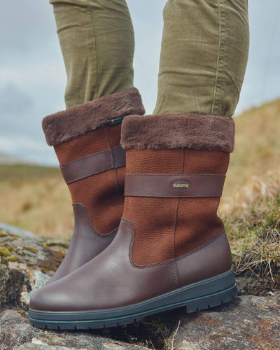 Walnut coloured Dubarry Foxrock Country Boot on rock background #colour_walnut