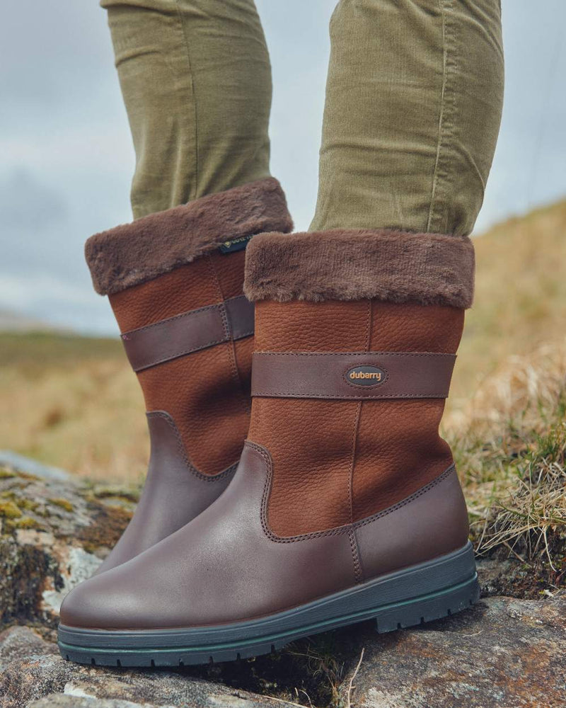 Walnut coloured Dubarry Foxrock Country Boot on rock background 