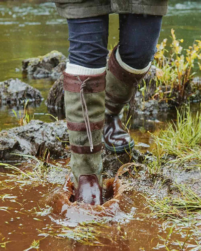 Ivy coloured Dubarry Galway Country Boots on mud water background #colour_ivy