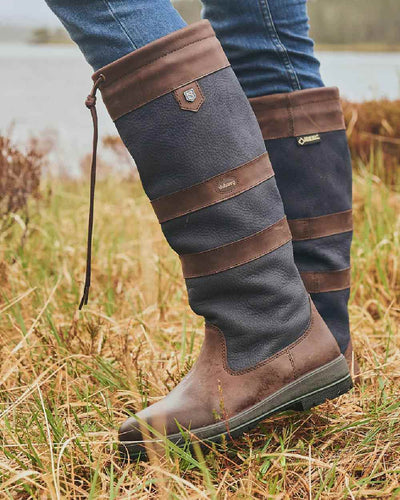 Navy Brown coloured Dubarry Galway Country Boots on grass background #colour_navy-brown