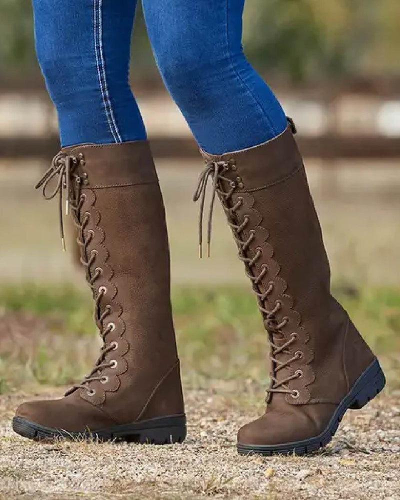 Chocolate coloured Dublin Admiral Boots on grass background 