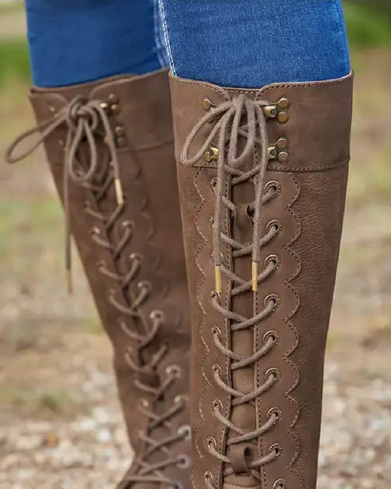 Chocolate coloured Dublin Admiral Boots on grass background 