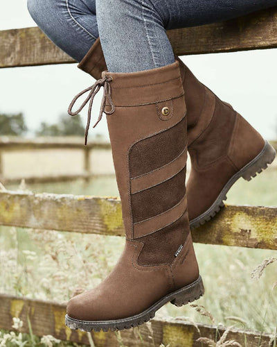 Chocolate coloured Dublin Kennet Boots on fences background #colour_chocolate