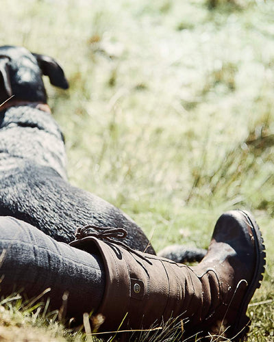 Chocolate coloured Dublin Kennet Boots on grass background #colour_chocolate