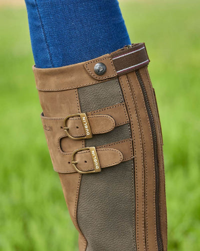 Dark Brown coloured Dublin Pollard Boots on blurry background #colour_dark-brown