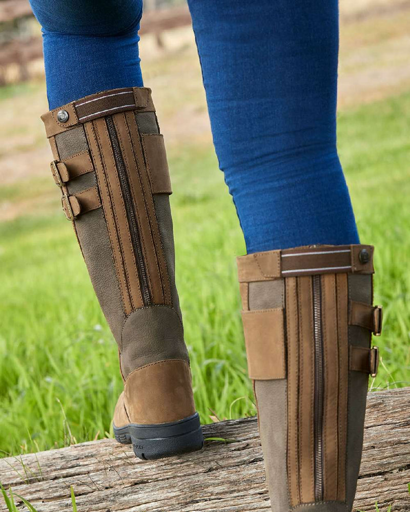 Dark Brown coloured Dublin Pollard Boots on grass background 