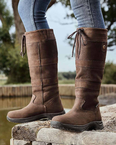 Chocolate coloured Dublin River Boots III on rock background #colour_chocolate