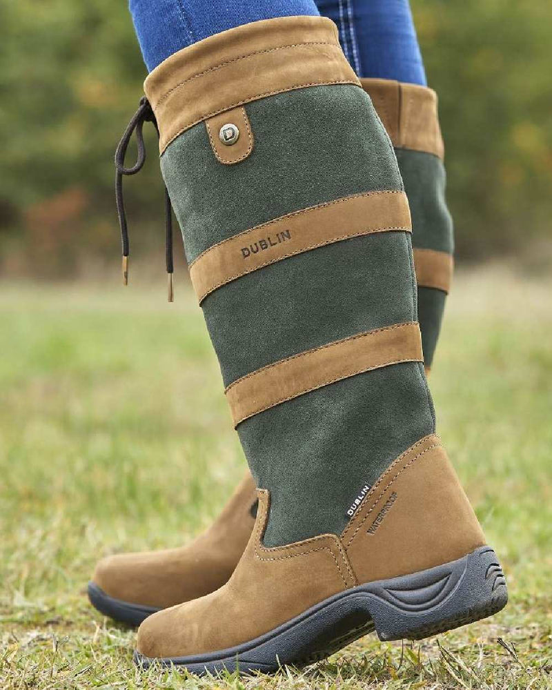 Dark Brown Green coloured Dublin River Boots III on grassy background 