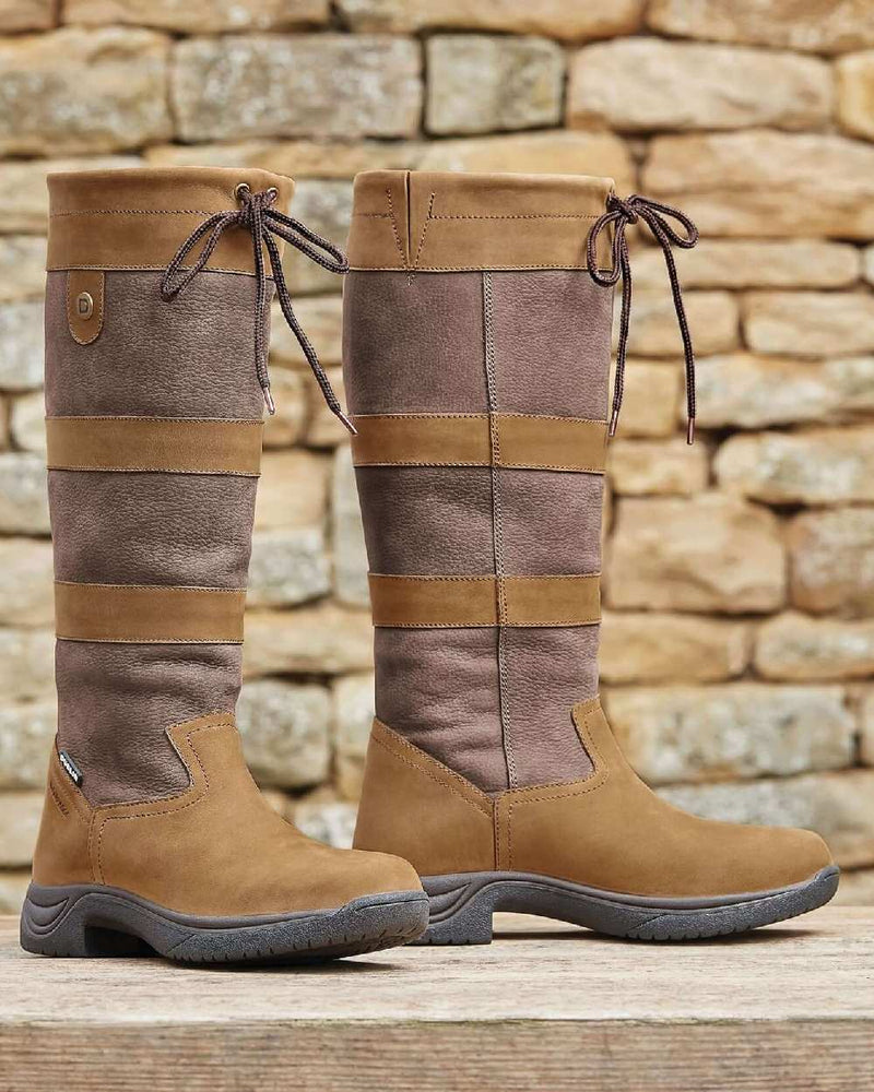 Dark Brown coloured Dublin River Boots III on rock wall background 